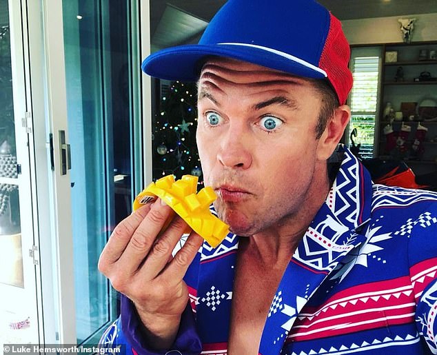 Fresh snack: Older brother Luke, 40, also shared a photo on Instagram in which he enjoyed a mango