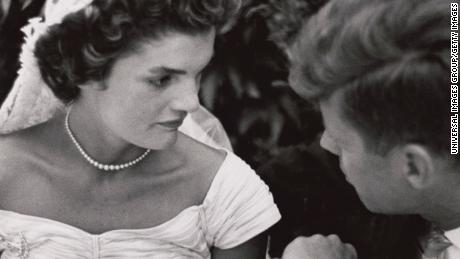 Jacqueline Bouvier Kennedy and Senator John F. Kennedy speak at their wedding in 1953.